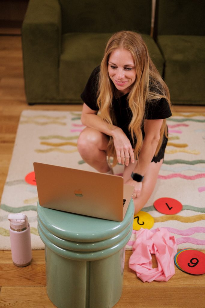 Anna on her laptop for an online personal training session